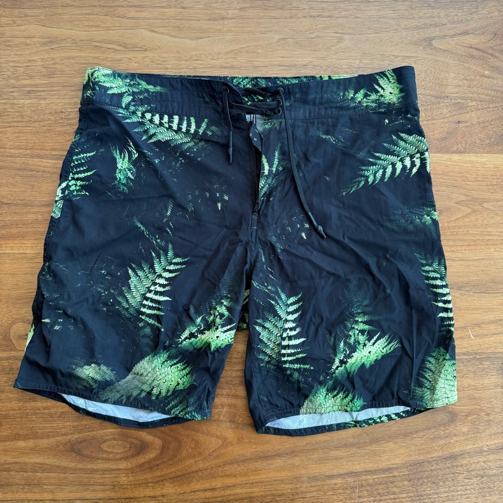 Outerknown Black and Green Board Shorts with Tropical Fern Design